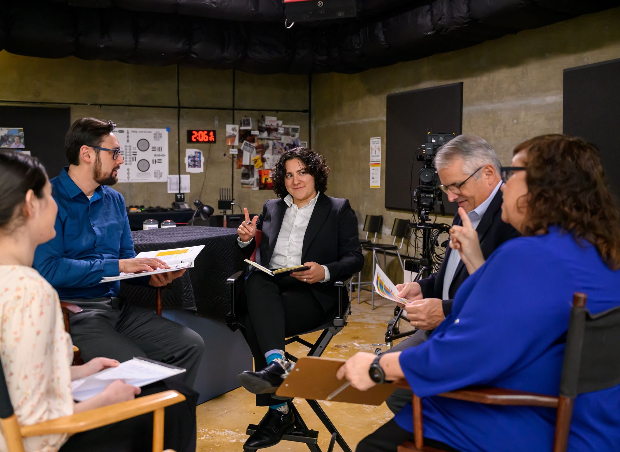A group of Family Theater Productions staff in a creative meeting. Learn about Family Theater Productions!